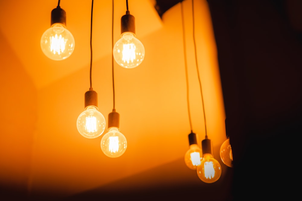 a group of light bulbs hanging from a ceiling