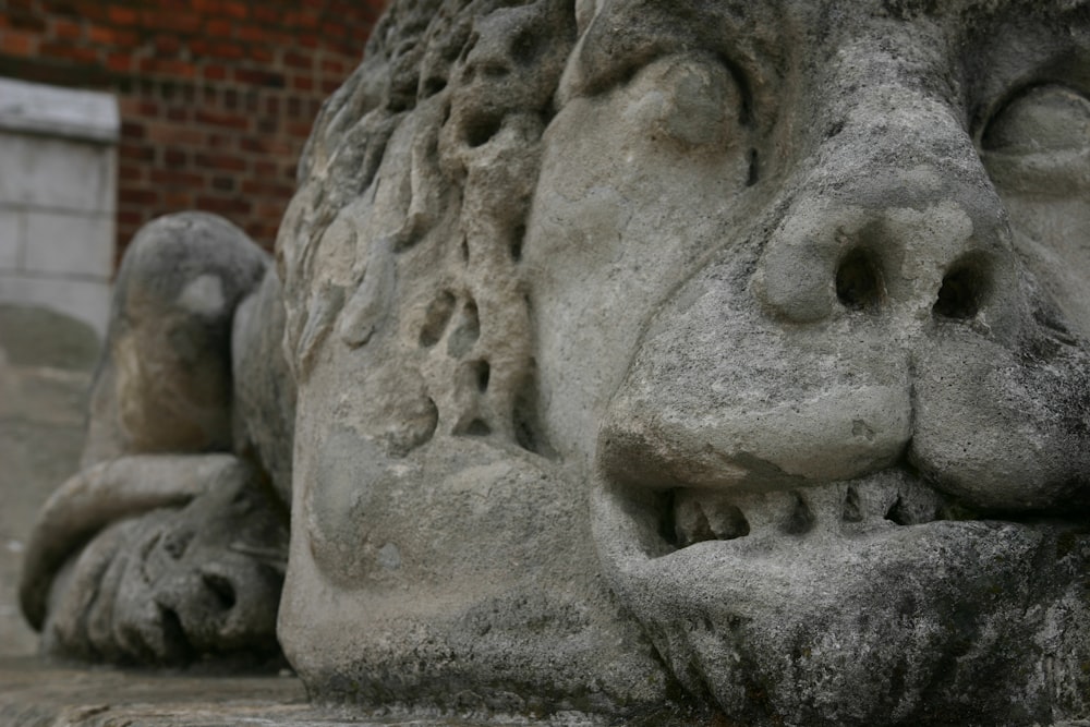 a close up of a stone sculpture of a lion
