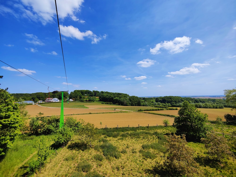 an aerial view of a field with a sky background