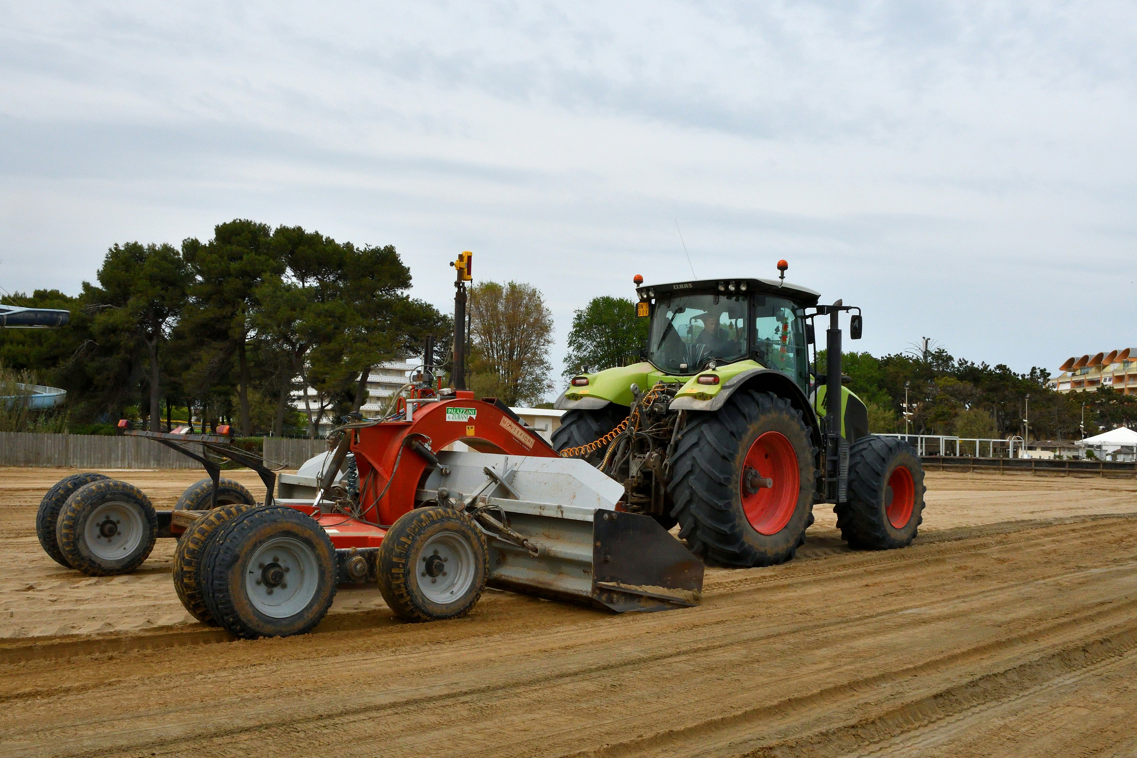 a tractor is parked on a dirt road