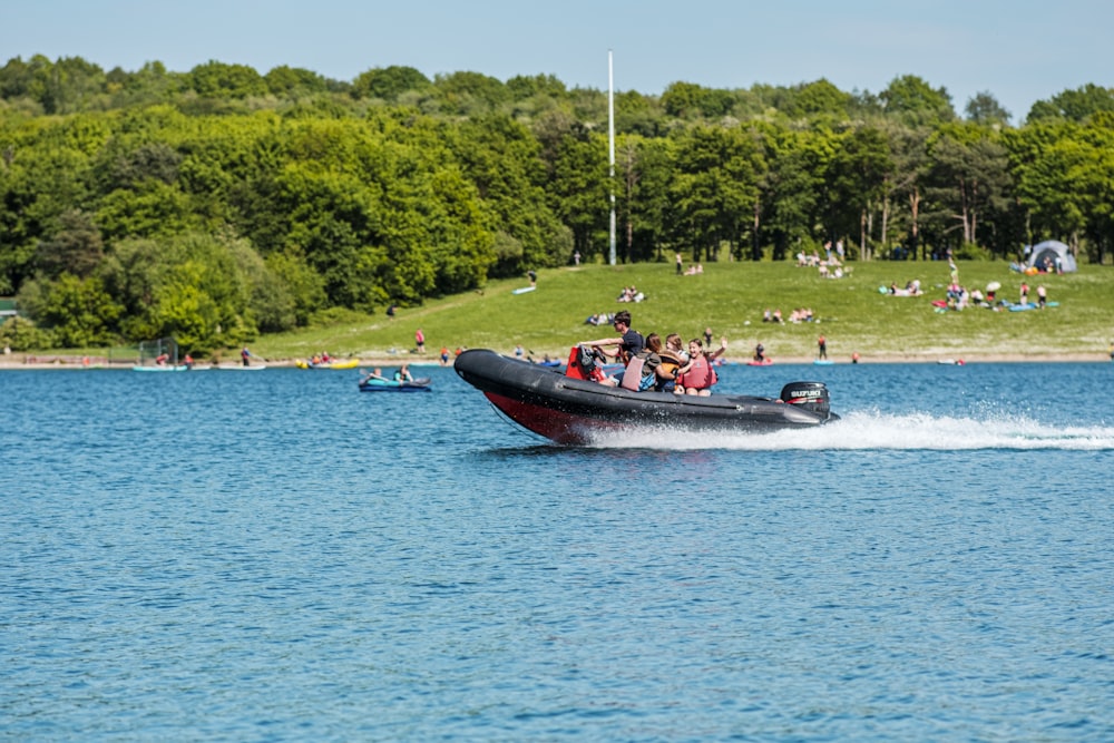 a group of people on a boat in the water