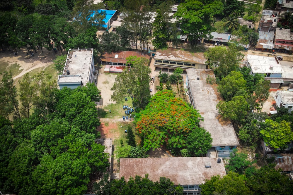 an aerial view of a building surrounded by trees