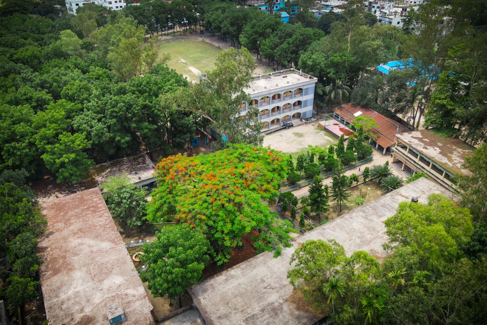 an aerial view of a building surrounded by trees