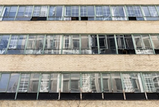 a tall brick building with lots of windows