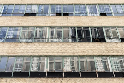 a tall brick building with lots of windows