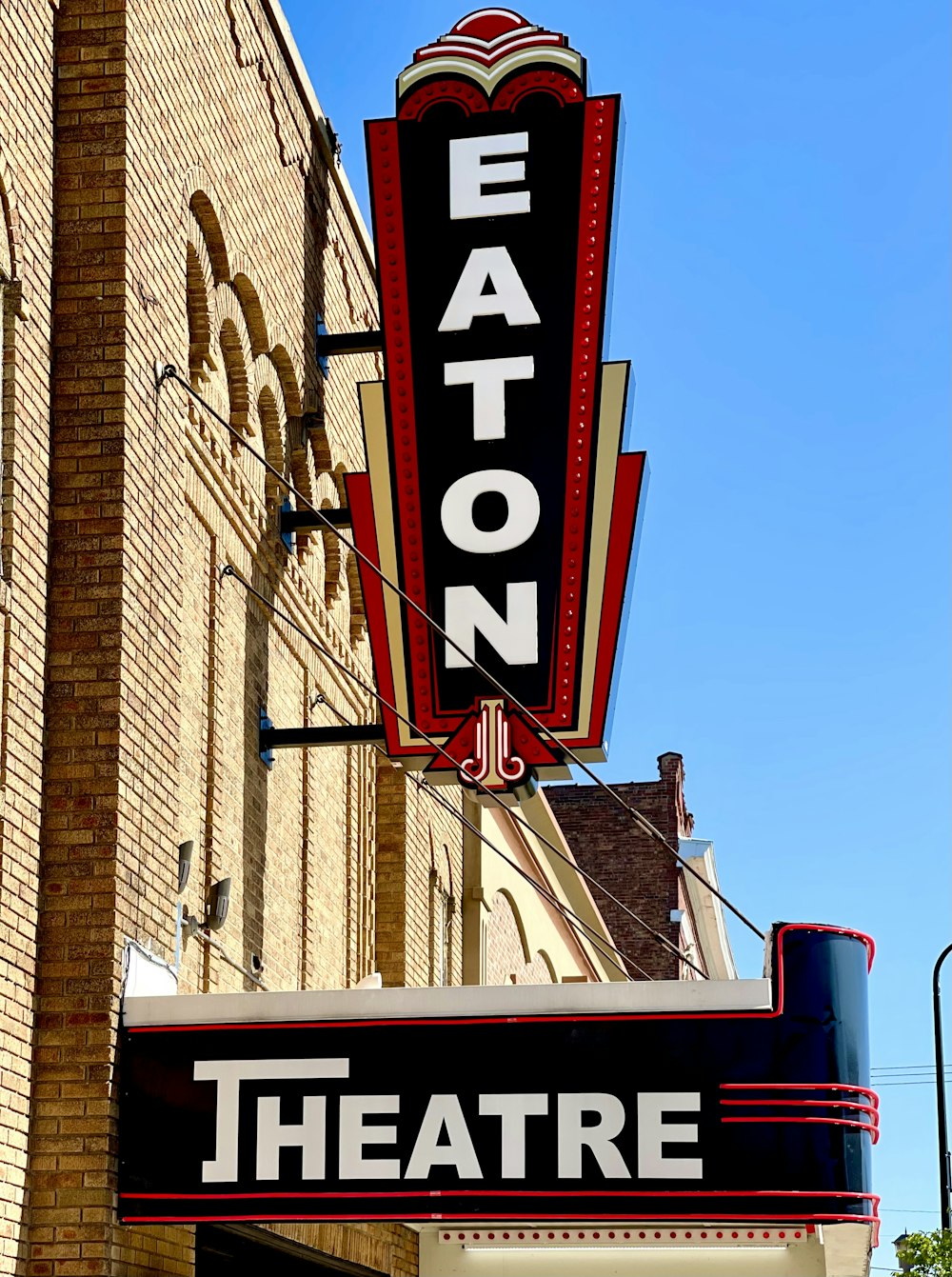 a theater sign on the side of a building