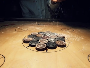 a group of buttons sitting on top of a wooden table