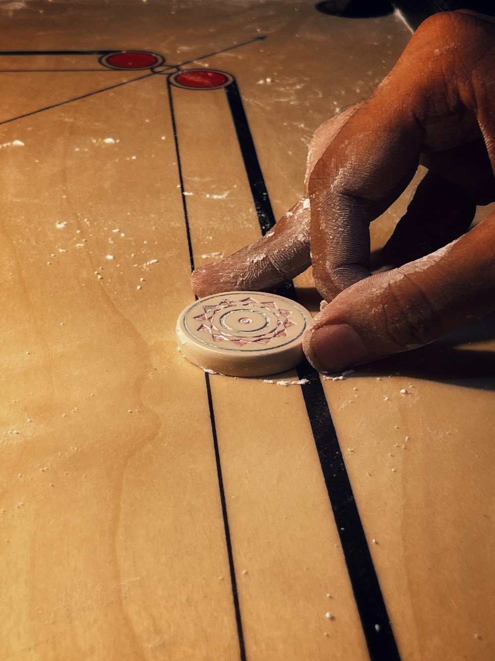 a person is playing with a frisbee on the floor