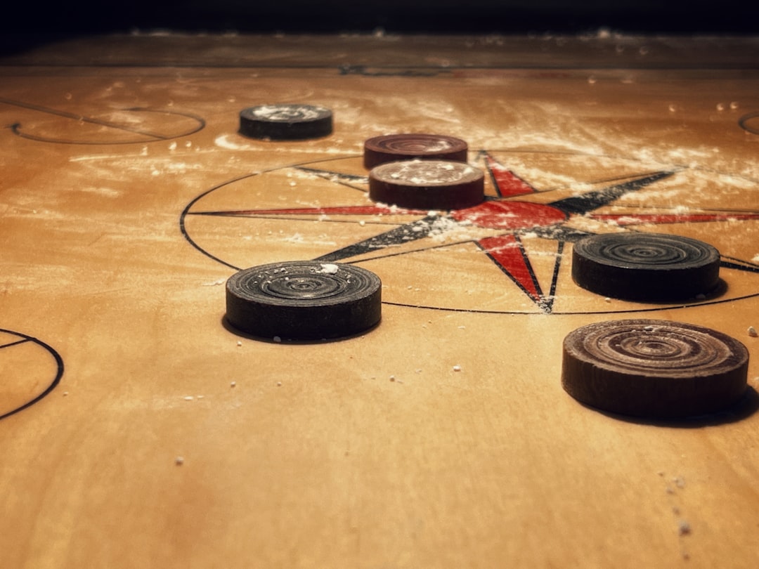 a close up of a wooden table with a star on it