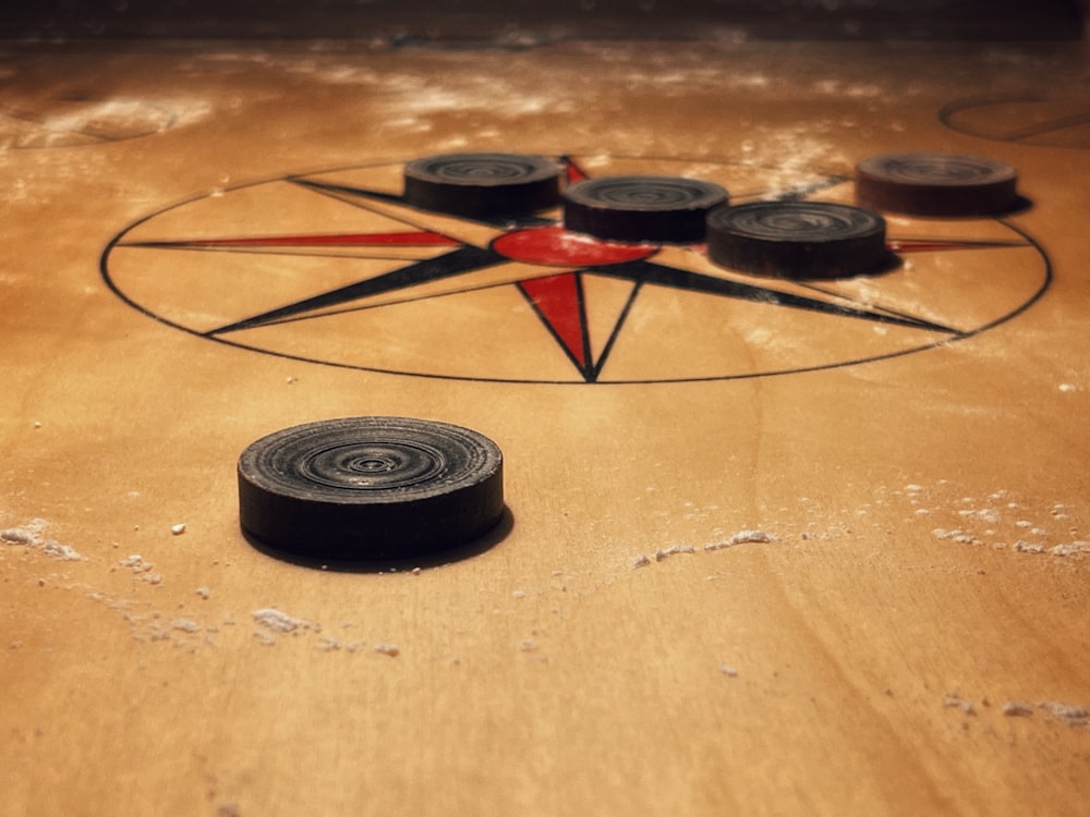 a close up of a wooden table with a star on it