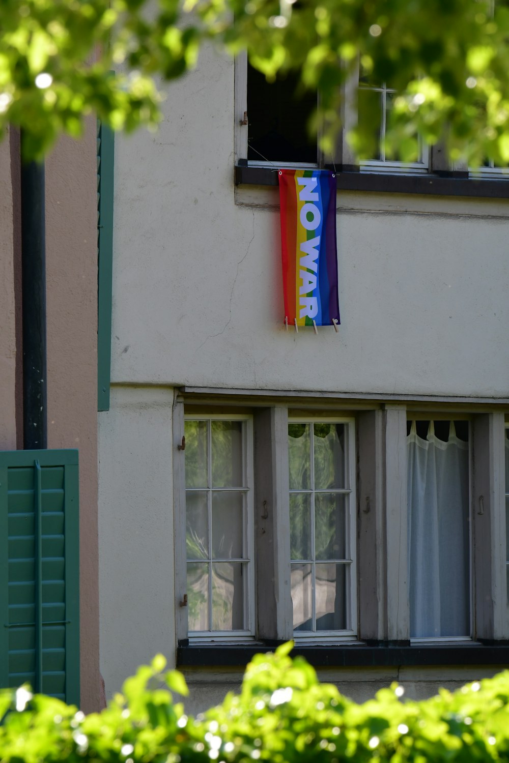 a flag hanging from the side of a building