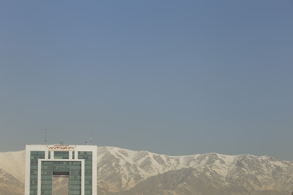 a tall building with a clock on the top of it