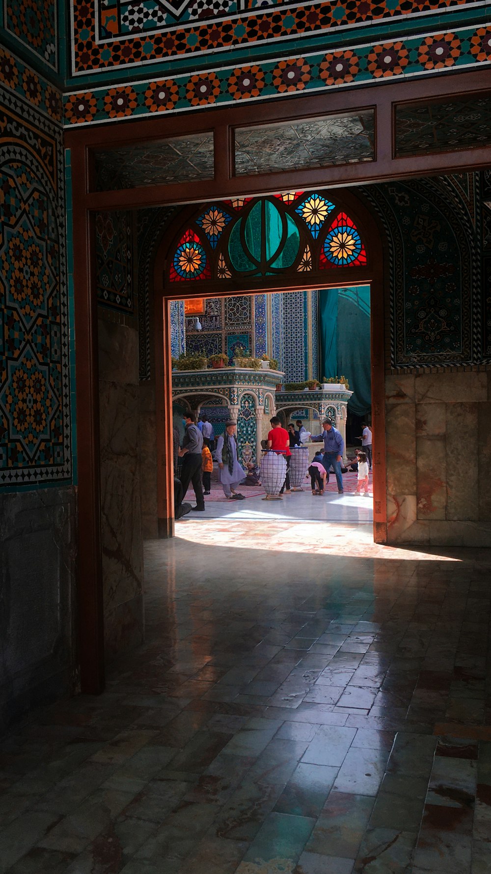 a group of people walking through a doorway