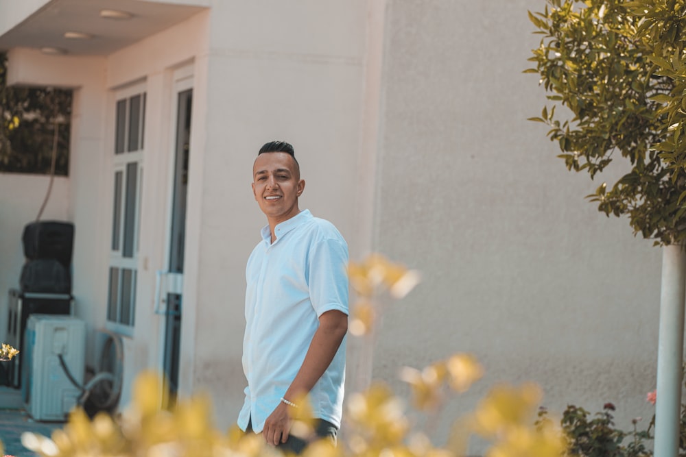 a man standing in front of a building