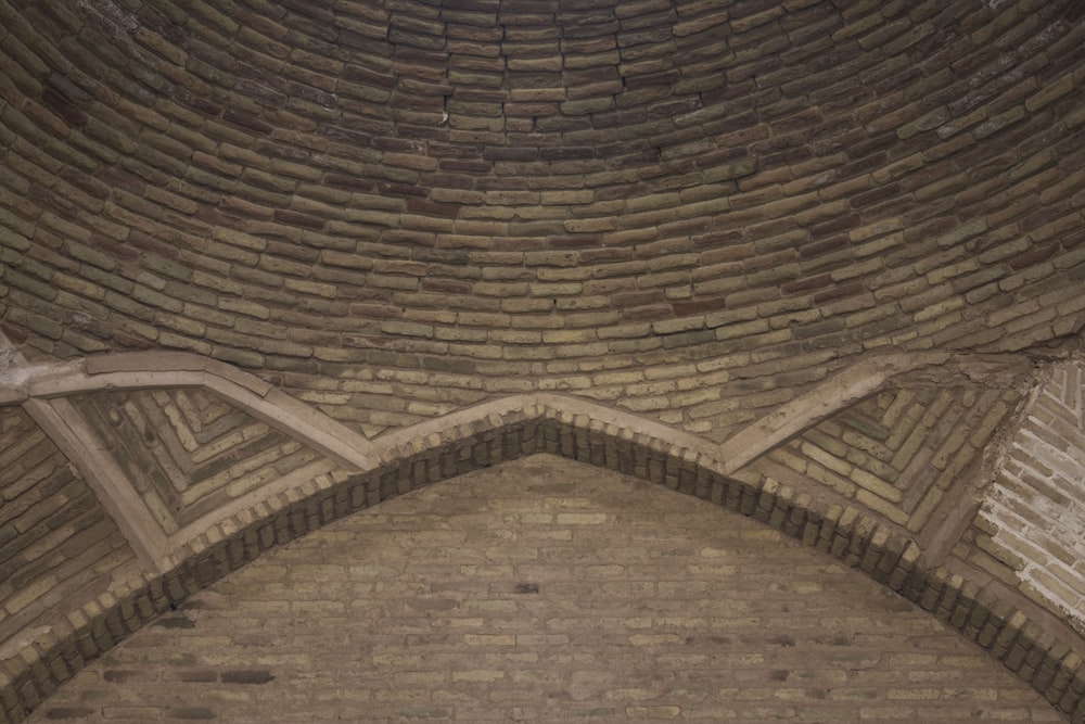 a brick building with a clock on the side of it