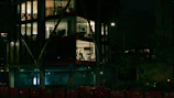 Nighttime shot of a luxury office lobby with warm lighting.