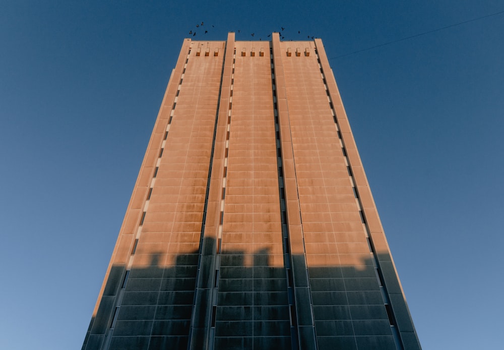 a tall building with a sky background