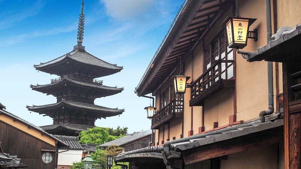 a tall building with a tall tower in the background