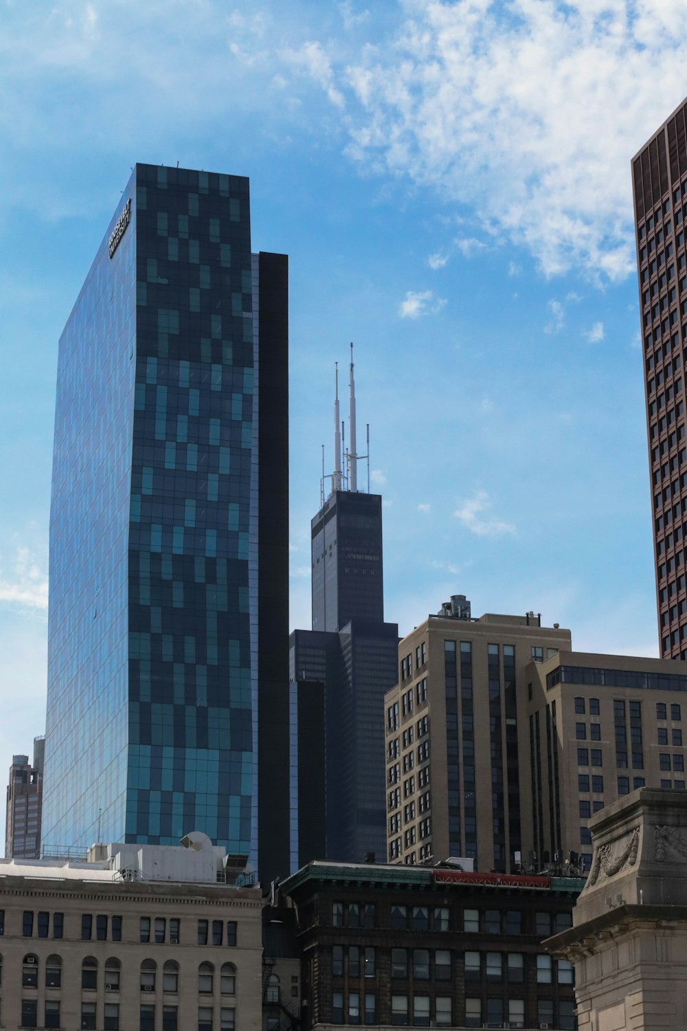 a group of tall buildings in a city