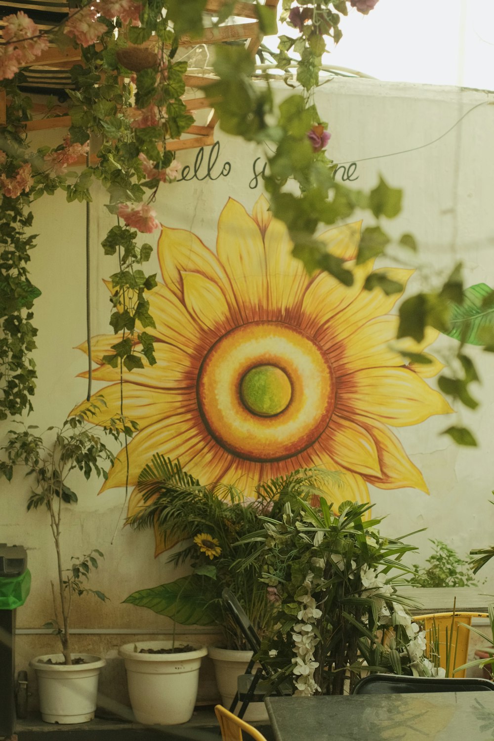 a sunflower painted on the side of a building
