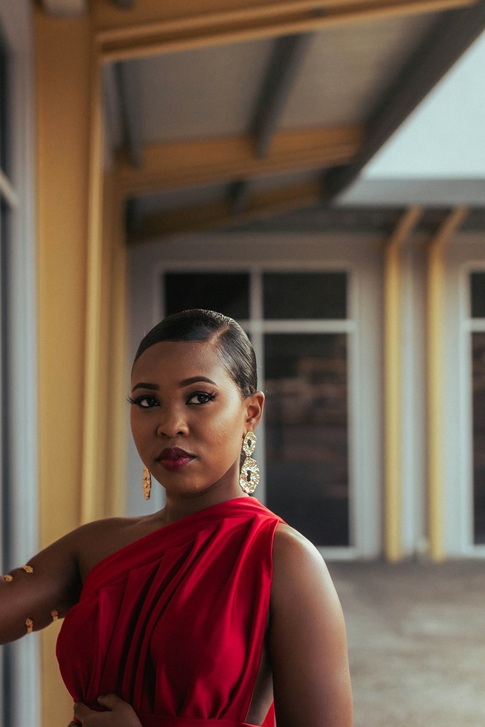 a woman in a red dress posing for a picture