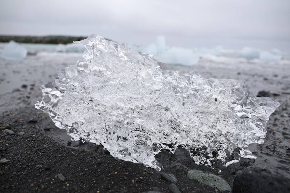 a piece of ice that is on the ground