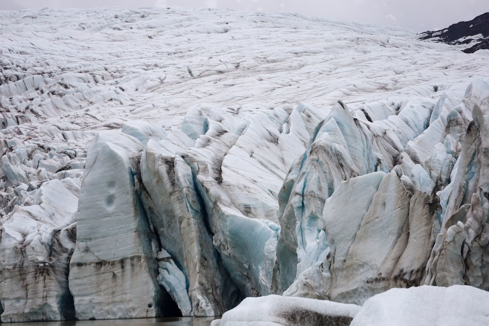 a large glacier with lots of snow on it