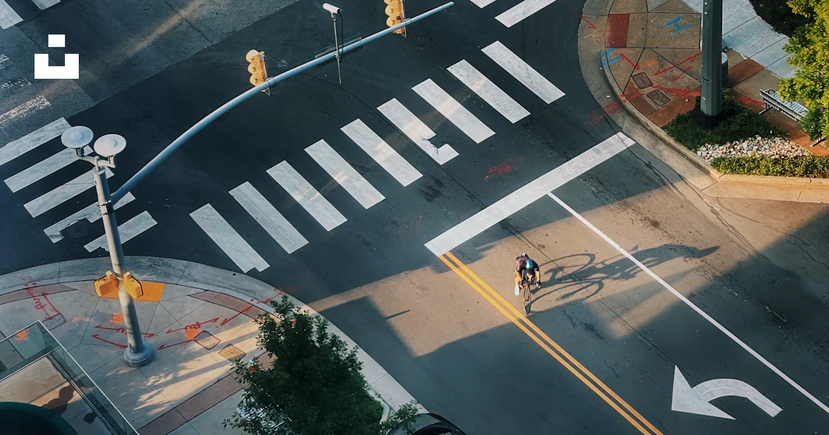 An overhead view of a street intersection with cars photo – Free Grey ...