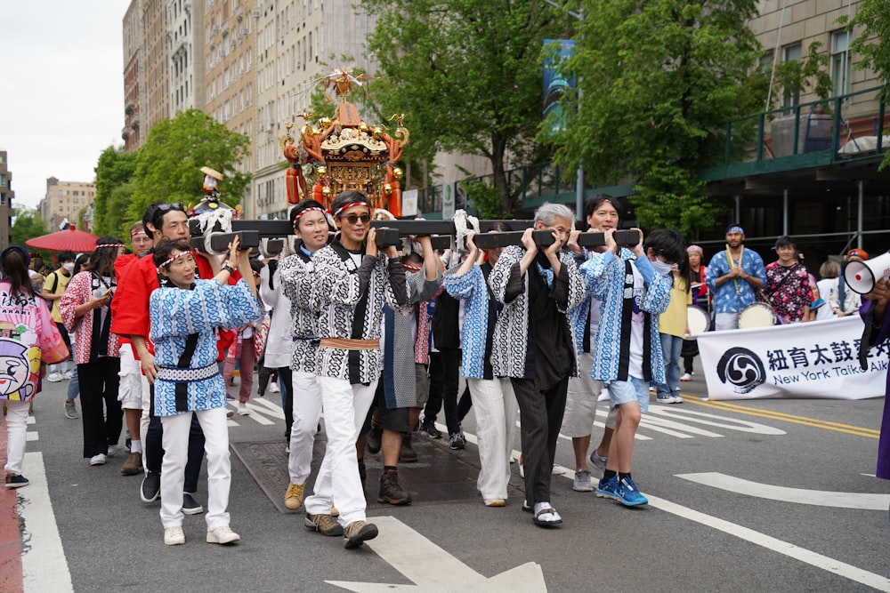 a group of people walking down a street