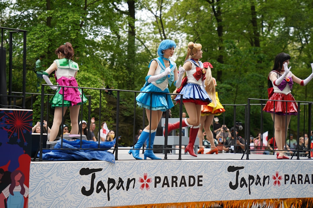 a group of people that are standing on a stage