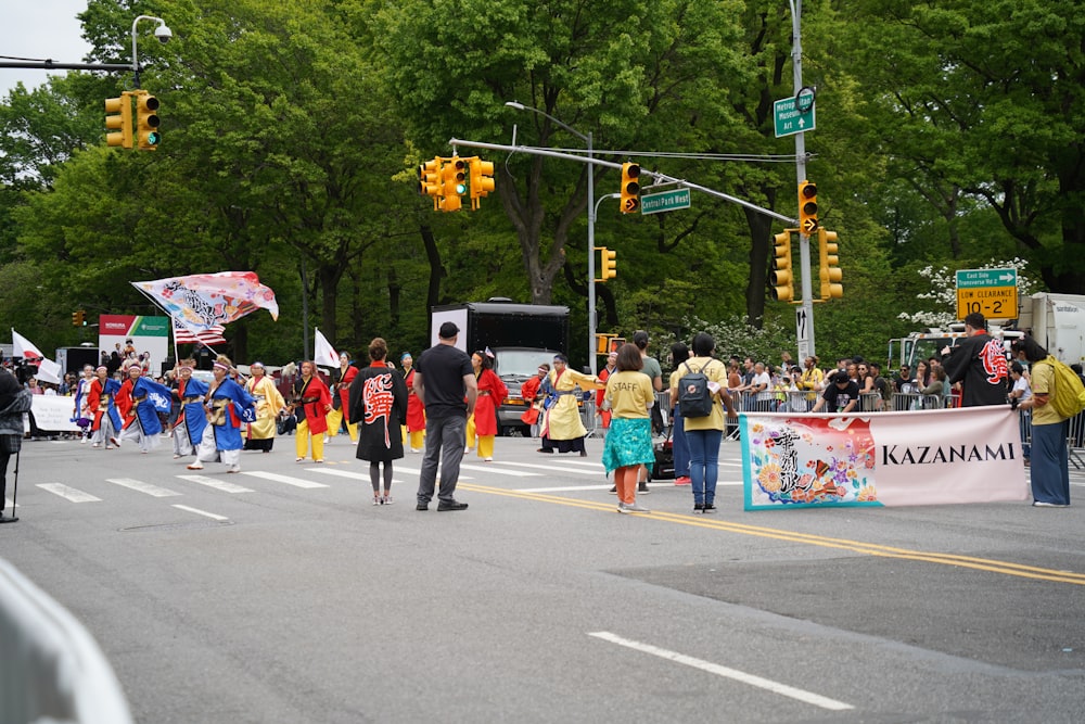 a large group of people walking down a street