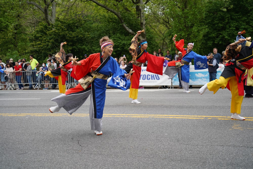 a group of people that are standing in the street