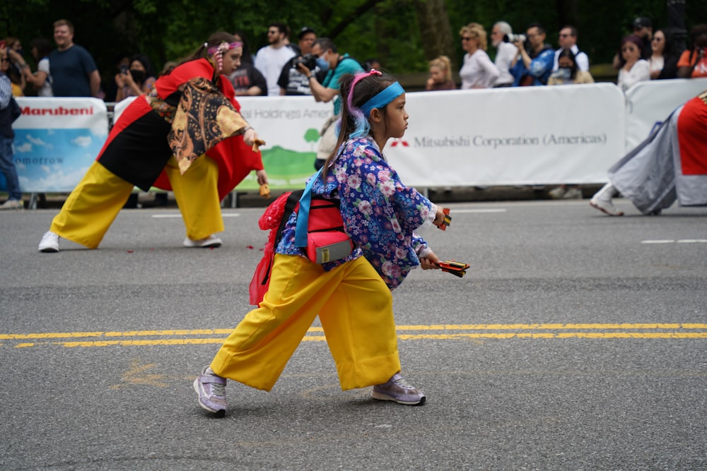 a group of people walking down a street