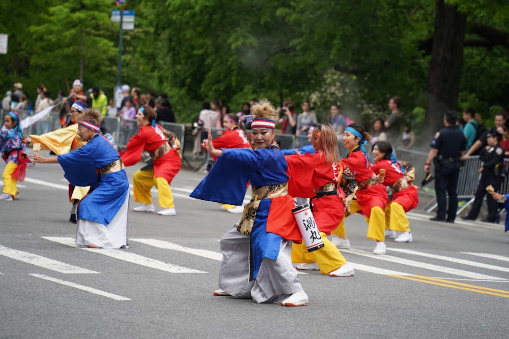 a group of people that are standing in the street