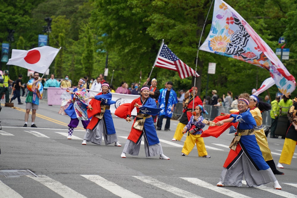 a group of people that are standing in the street