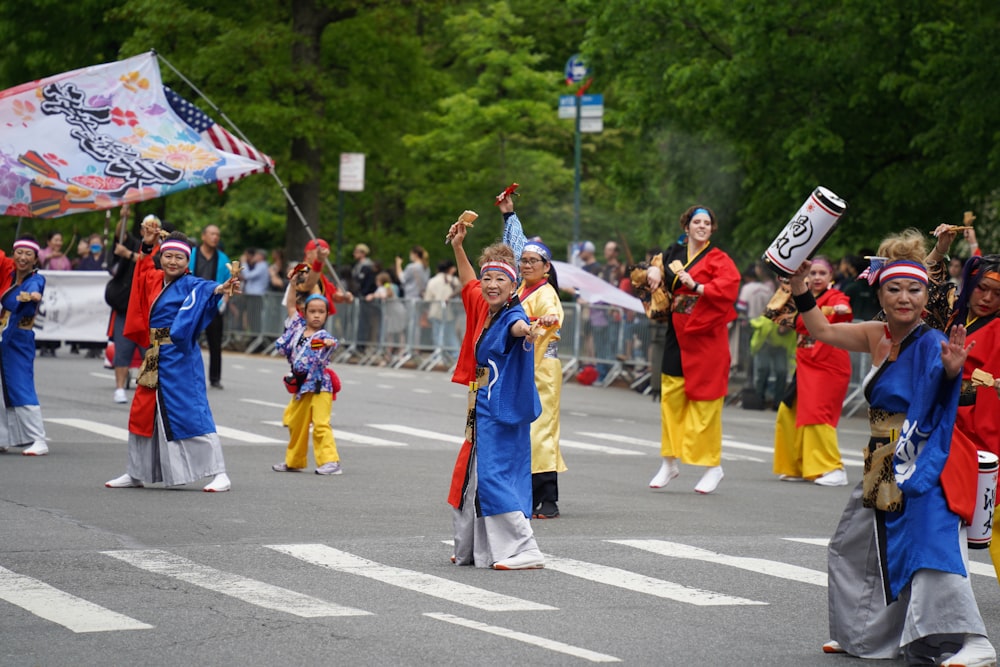 a group of people that are standing in the street