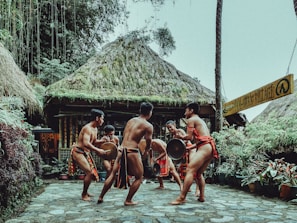 a group of men playing a game of drum