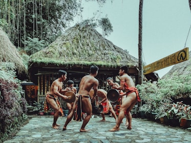 a group of men playing a game of drum