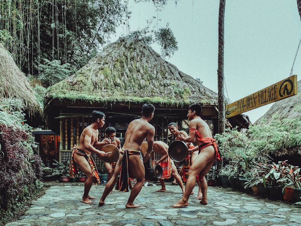 a group of men playing a game of drum