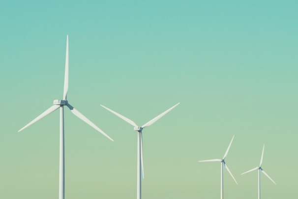 a group of wind turbines in a field