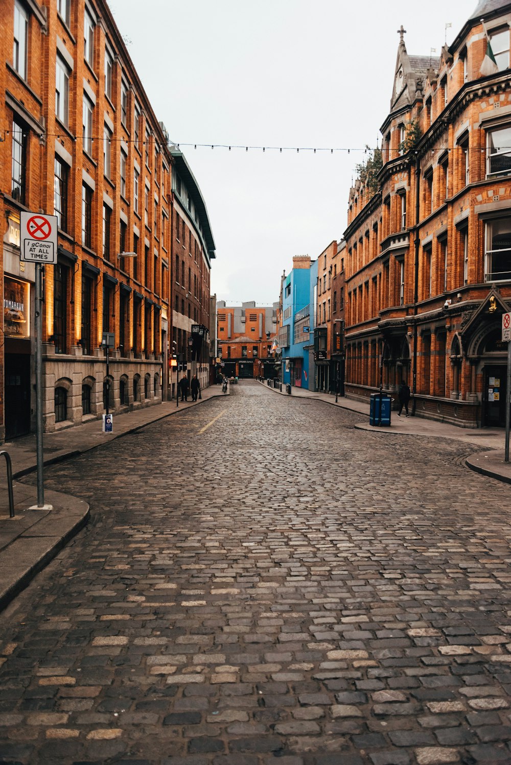 a cobblestone street in a european city