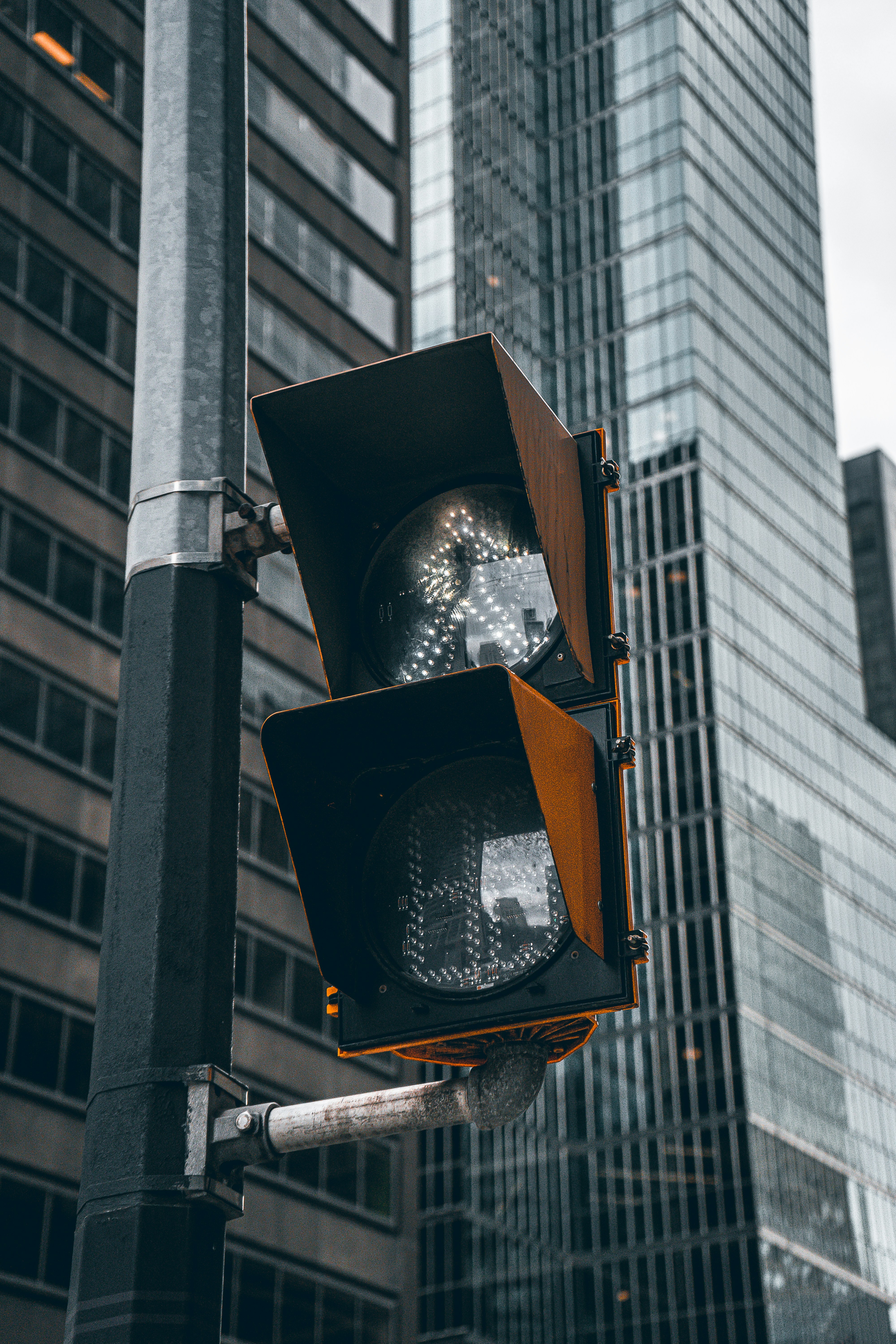 a traffic light sitting next to a tall building
