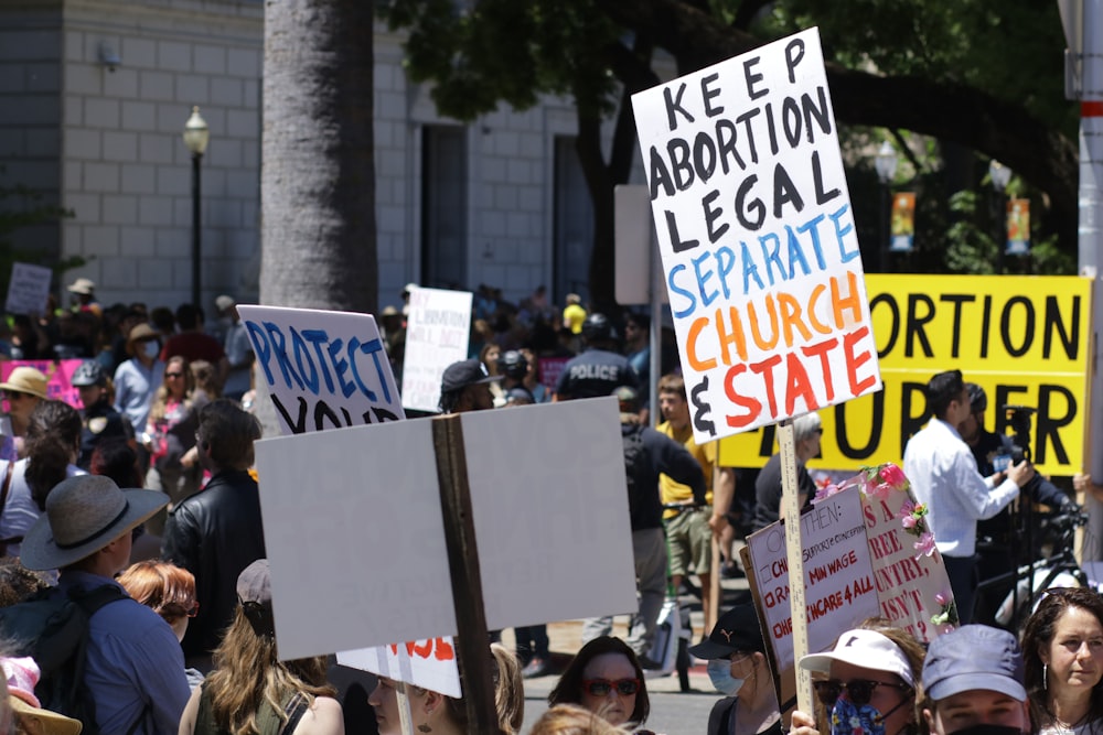 a large group of people holding up signs