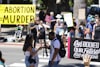 Pro-life and pro-choice protesters square off. Photo by Aiden Frazier / Unsplash