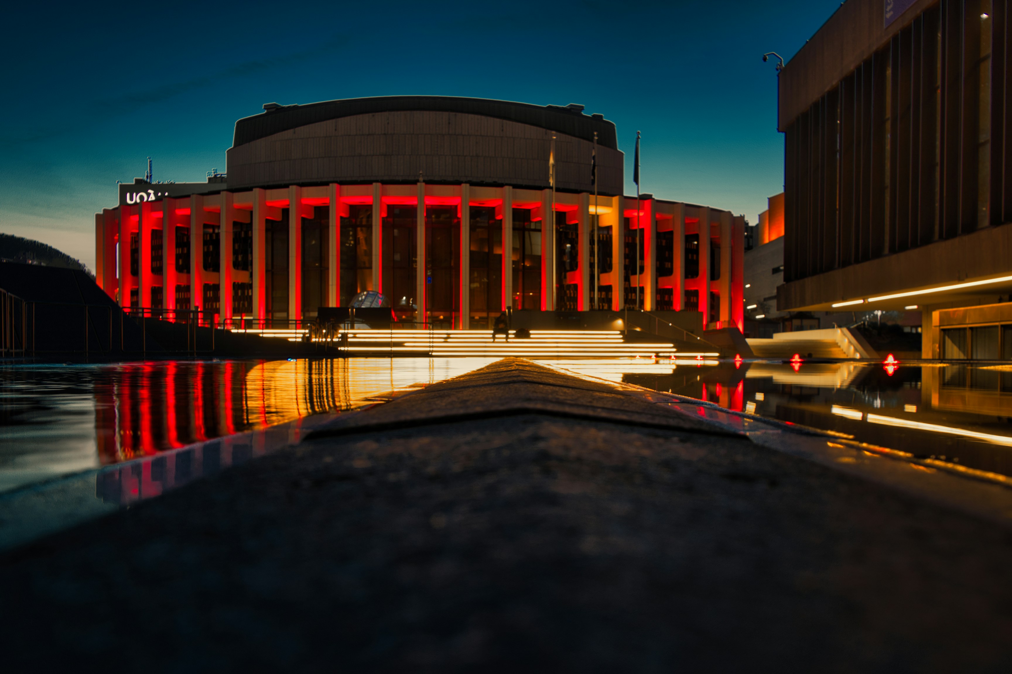 a large building with a red light on it's side