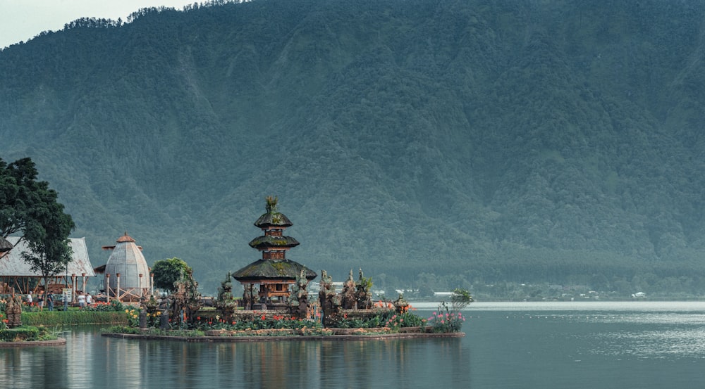 a large body of water with a small island in the middle of it