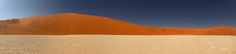 a large sand dune in the middle of a desert