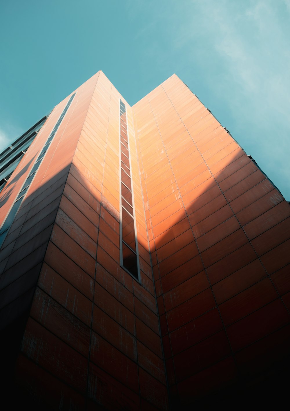 a tall building with a sky background