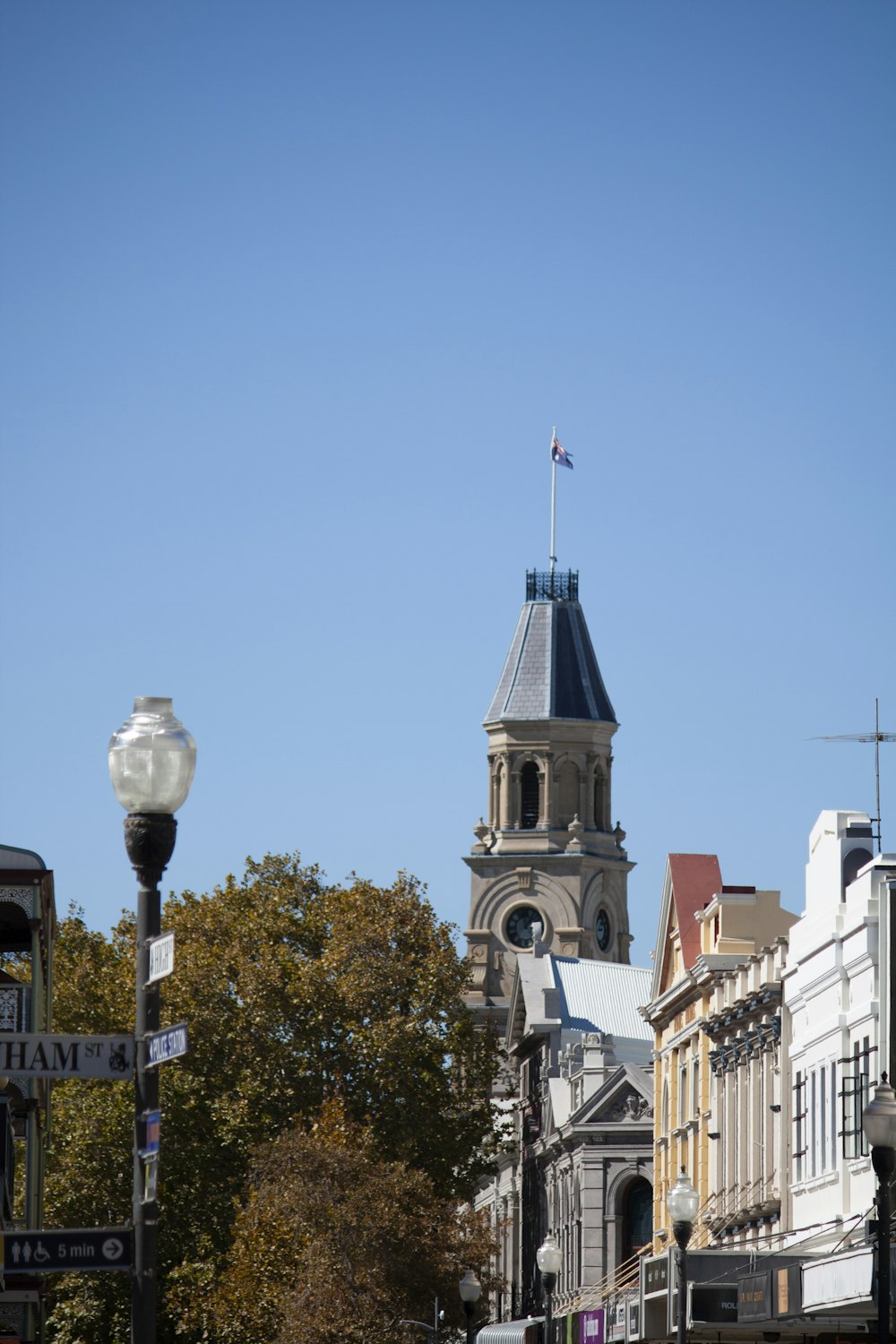 a tall clock tower towering over a city