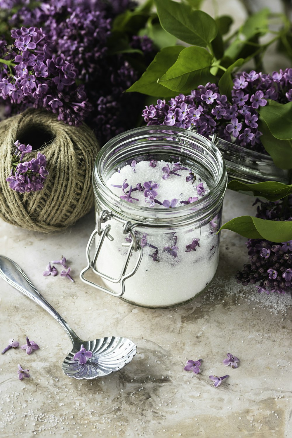 a jar of lavender sugar next to a ball of twine